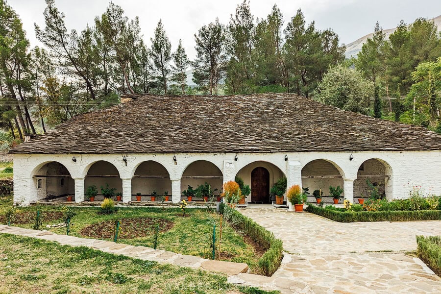 St Friday Church in Permet, a long church with arches and a stone roof.