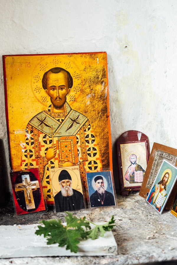 Icons and offerings at St Nicholas Church in Permet, Albania.