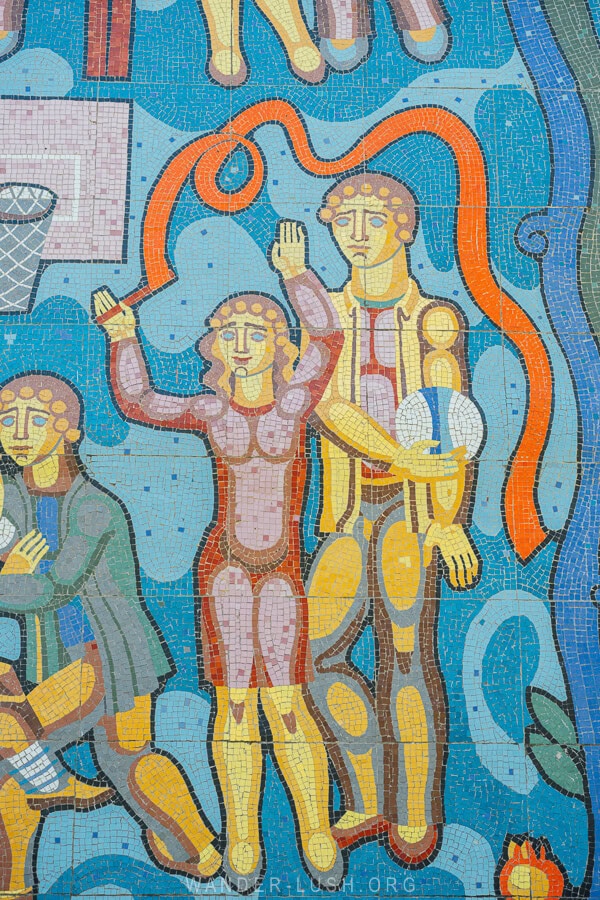 A mosaic depicting kids playing sports on the wall of a school in Kakhati, Georgia.