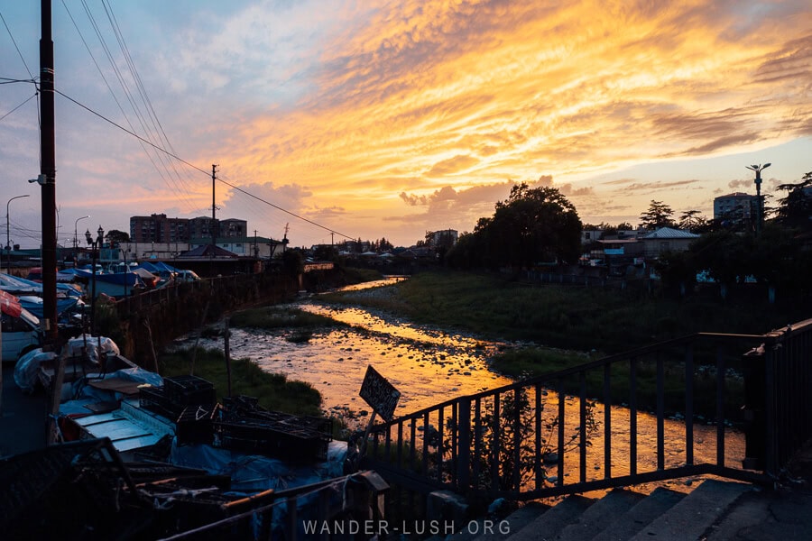 A vivid sunset on the Enguri River in Zugdidi, Georgia.