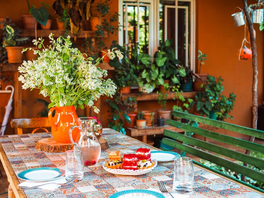 Cakes laid out on a bright table in the courtyard of Casa de Khasia hotel in Zugdidi, Georgia.