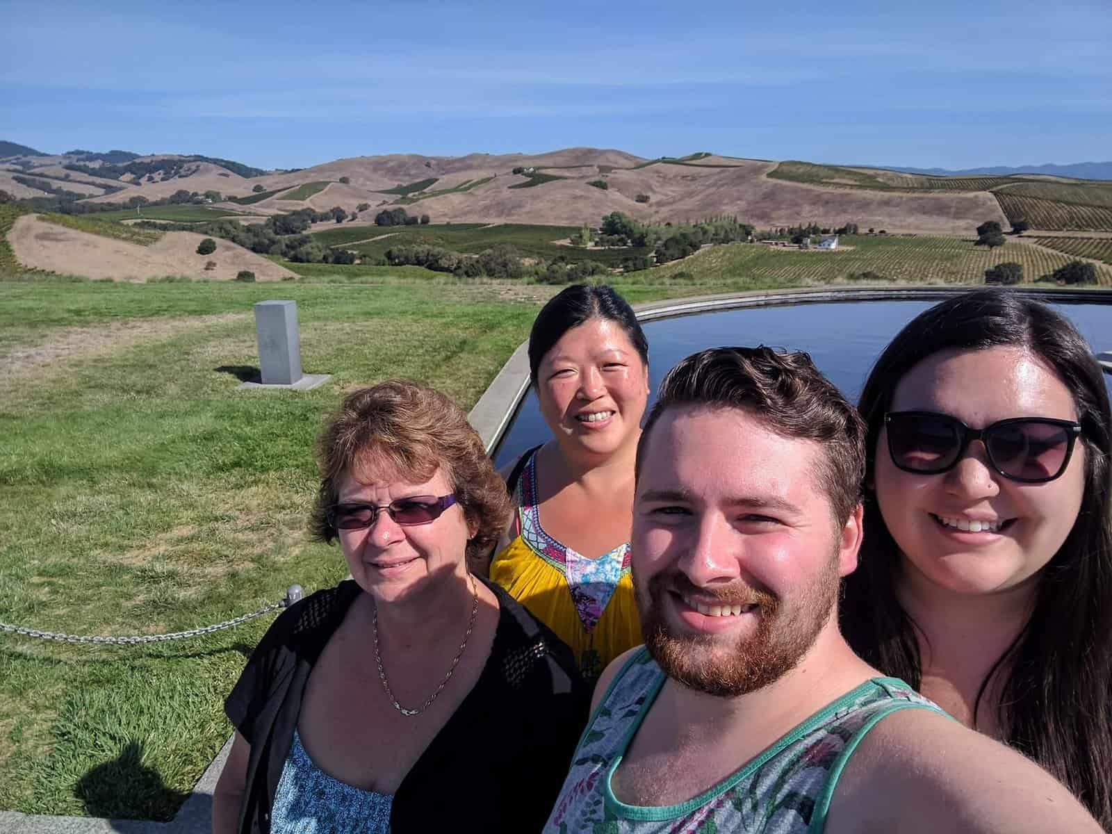 Selfie of Colin, Riana and their moms on a 2017 trip to Napa, California