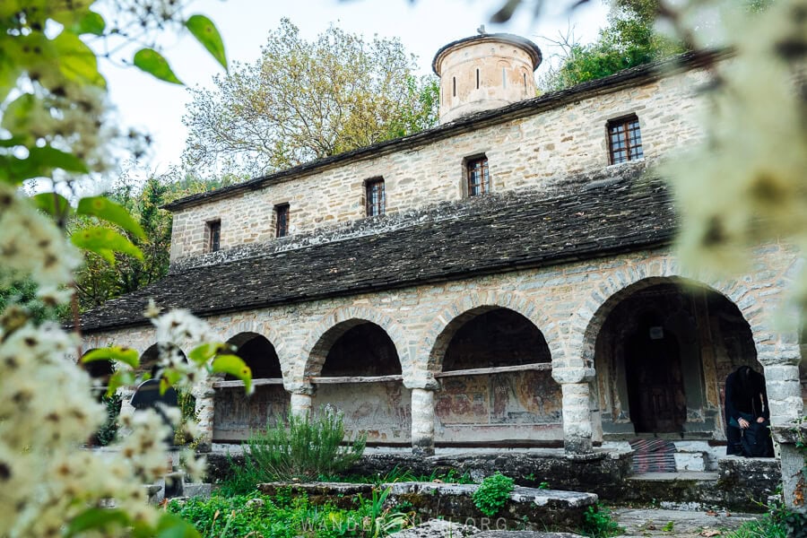 The Church of Leus, a pumice stone church with arched alcoves on the first level.