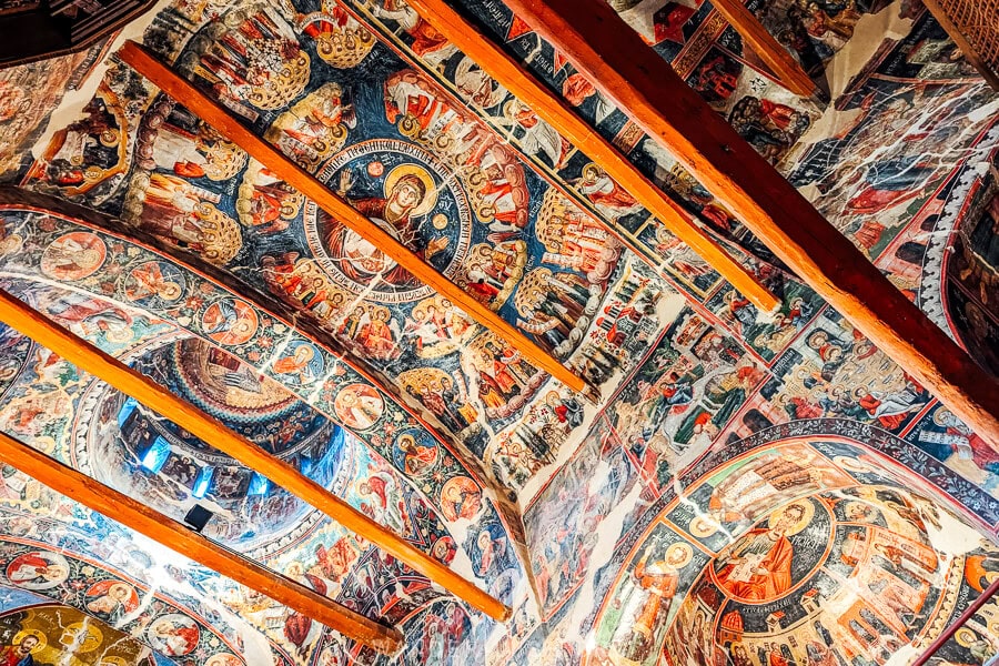 Looking towards the painted dome of the Church of Leus, with wooden ceiling beams.