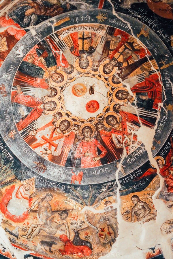 A circular icon painting in the dome of the Church of Leus, depicting the saints.