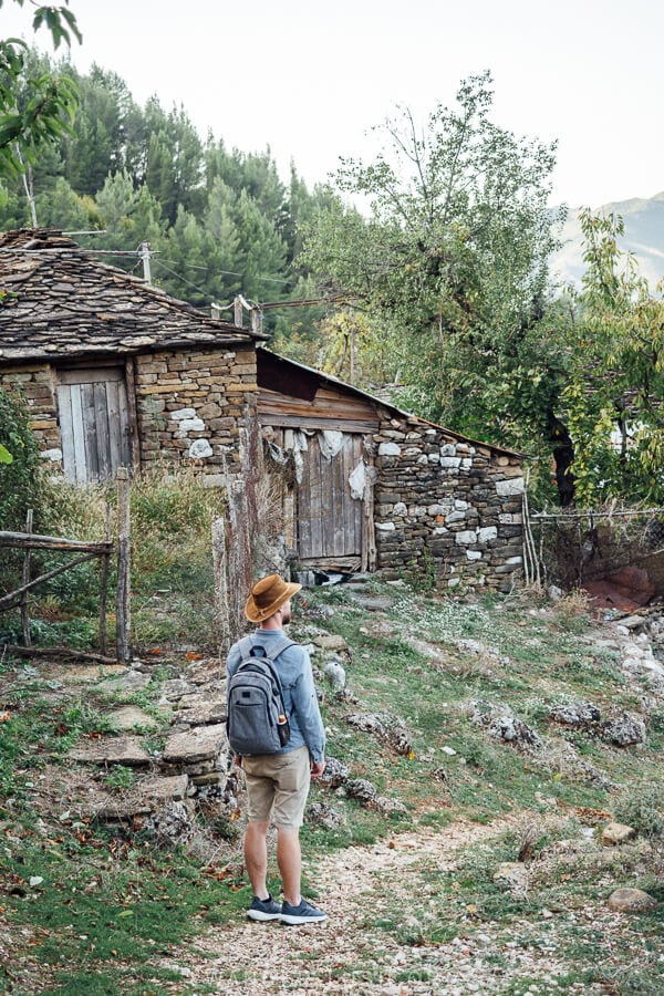 A man walks through the charming village of Leus in Albania.