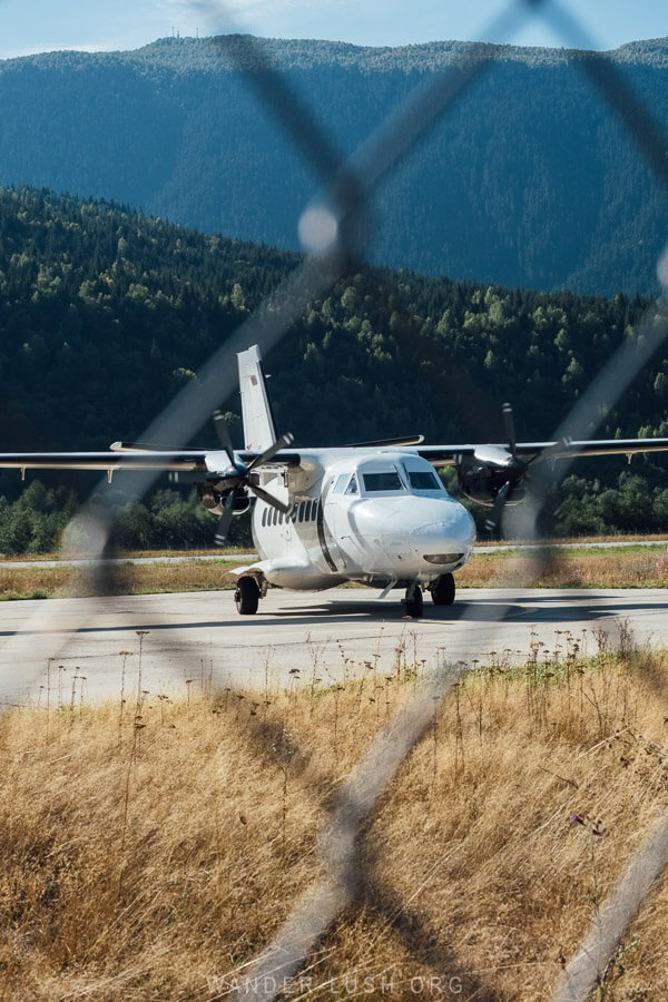 A prop plane lands at Mestia Airport.