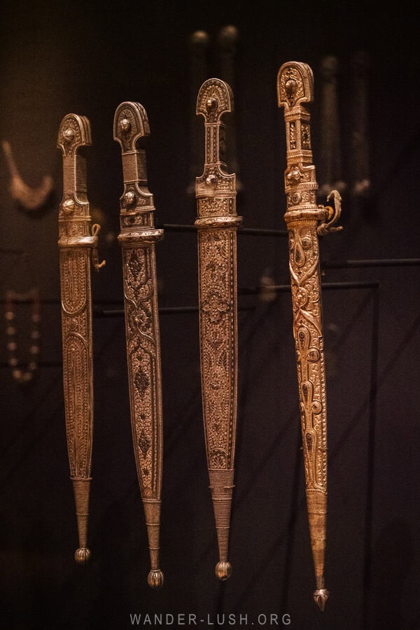 A display of four daggers inside the Ethnography Museum in Mestia.