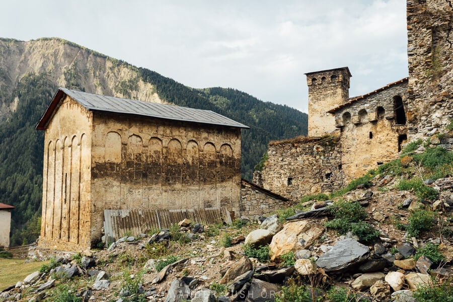 An old stone church and defensive towers in Zhamushi, Svaneti.