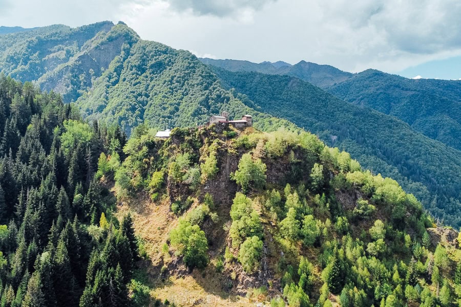 Lagurka Church of Kala, a church set on a hilltop surrounded by pine forest on the road between Mestia and Ushguli.