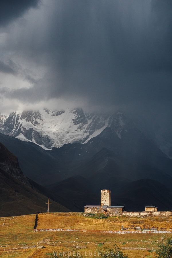 Ushguli Lamaria Church against a stormy sky.