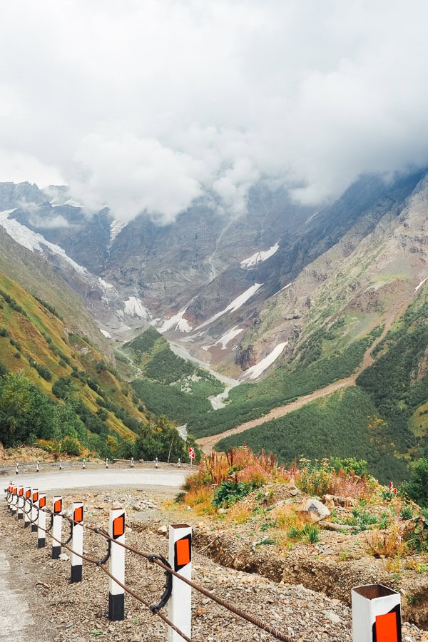 A glacier and mountains visible around a bend on the new Ushguli Lentekhi Kutaisi Road in Svaneti, Georgia.