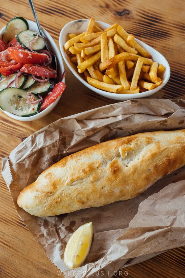 Trout baked in bread with a side of salad and fries at Hikers Cafe in Mazeri, Svaneti.