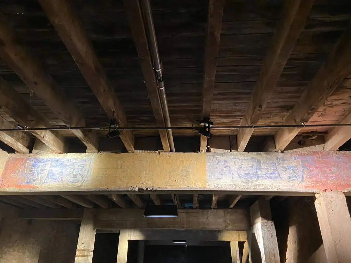 Paintings above the theatre area of Camp des Milles, France