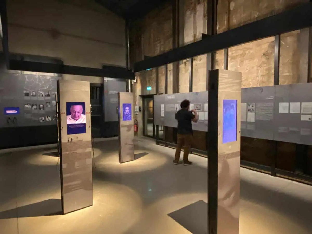 Display showing stories from people who stayed at Camp des Milles, Provence, France