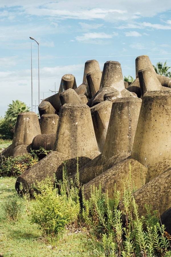 Concrete dolosse stacked in a field in Tikori, Georgia.