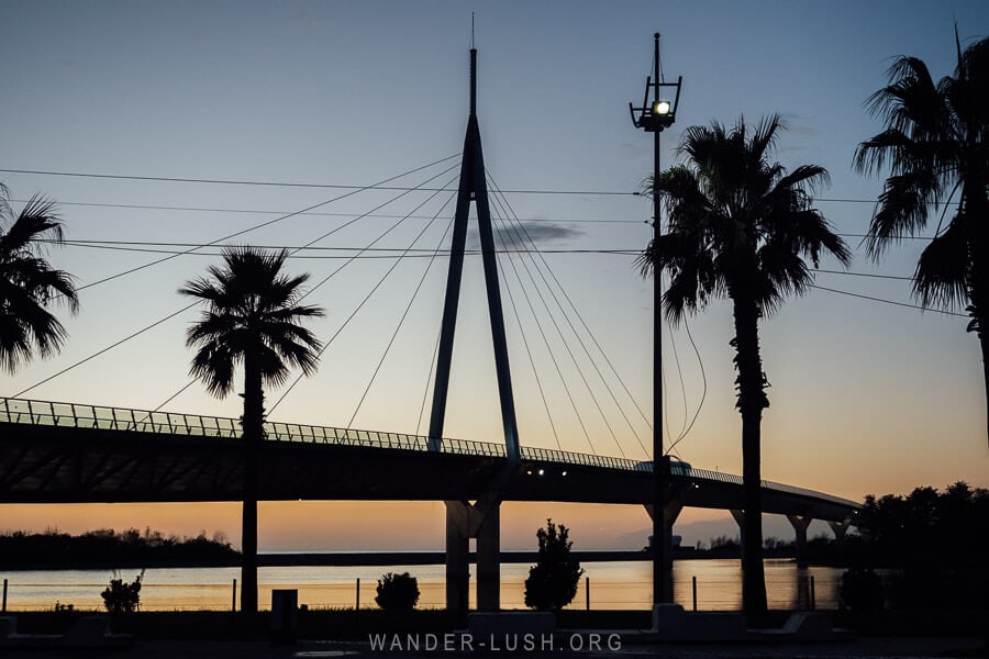 Anaklia Bridge silhouetted at night, one of the longest wooden pedestrian bridges in Europe.