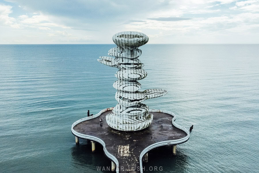 The Pier Sculpture, a tall metal installation on a concrete platform over the Black Sea in Anaklia, Georgia.