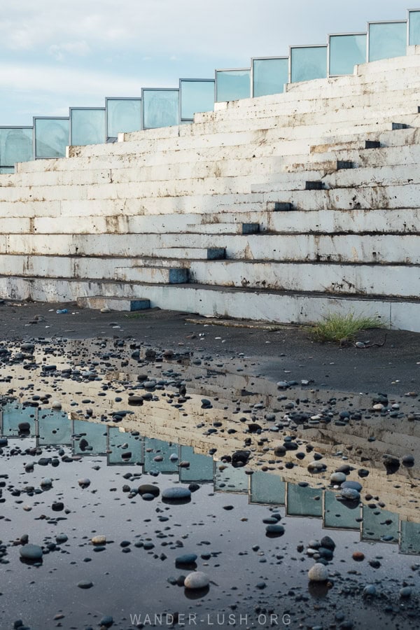 Concrete bleachers at the abandoned Ganmukhuri Amphitheatre on the Black Sea in Anaklia, Georgia.