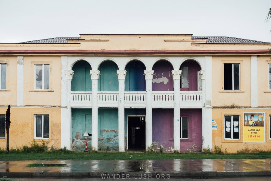 A dissused government building in Anaklia with an ombre mural painted on its facade.