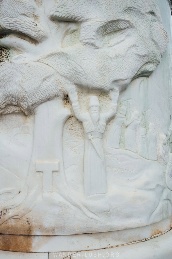 A stone tableau depicts a man dressed in traditional garb on the base of the Circassian Genocide Memorial in Anaklia, Georgia.