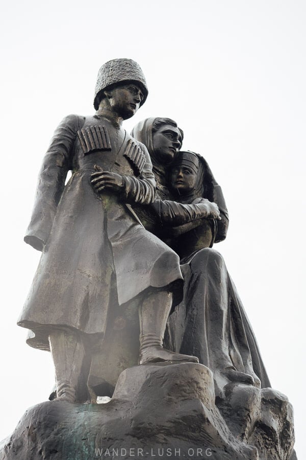 A statue of a mother and her two children, the Circassian Genocide Memorial in Anaklia, Georgia.