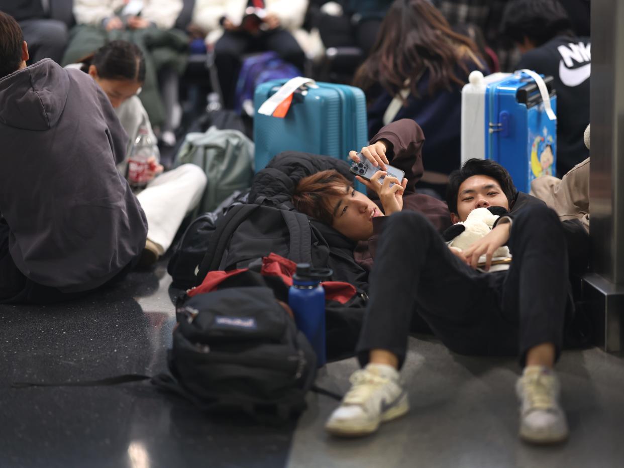 Travelers pass through O'Hare Airport as Thanksgiving holiday travel.