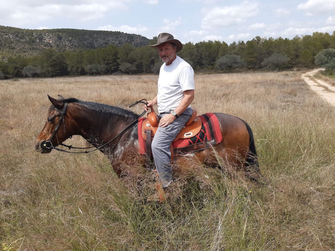 John, pictured in Spain, says he and his wife they got the idea to move to Europe after traveling over to visit two foreign exchange students who had stayed with them.