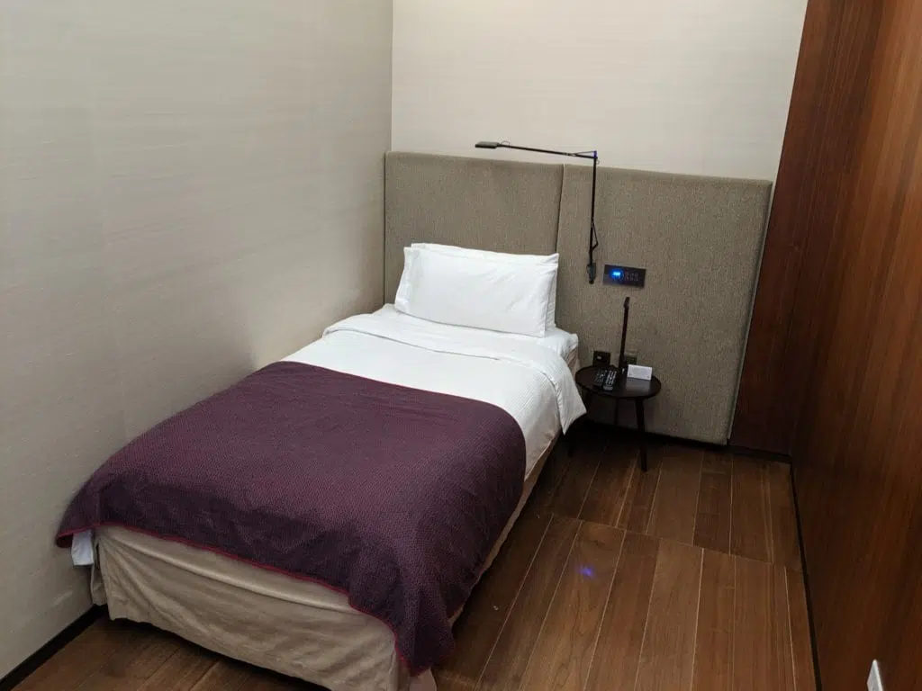 a bed inside the sleeper rooms in the Qatar Al Safwa first class lounge