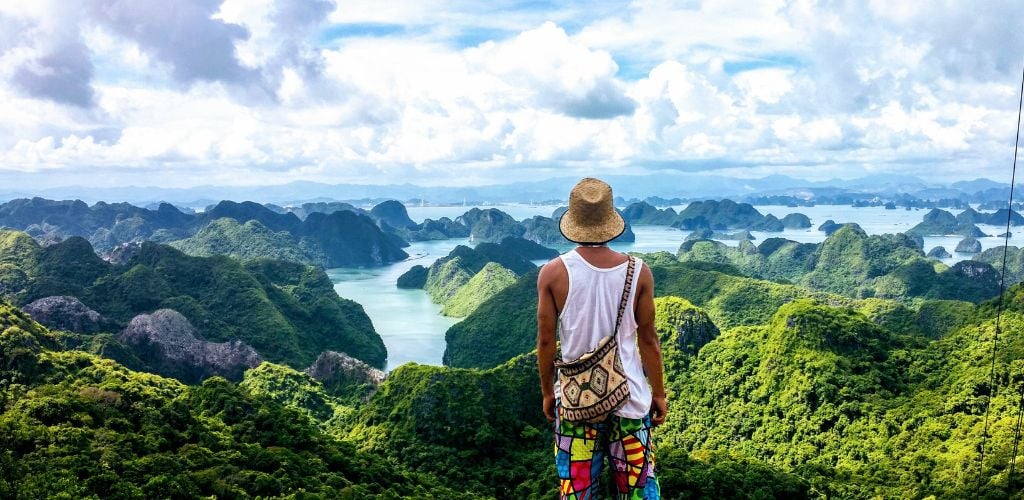 Man overlooking Ha Long Bay in Vietnam, feature image