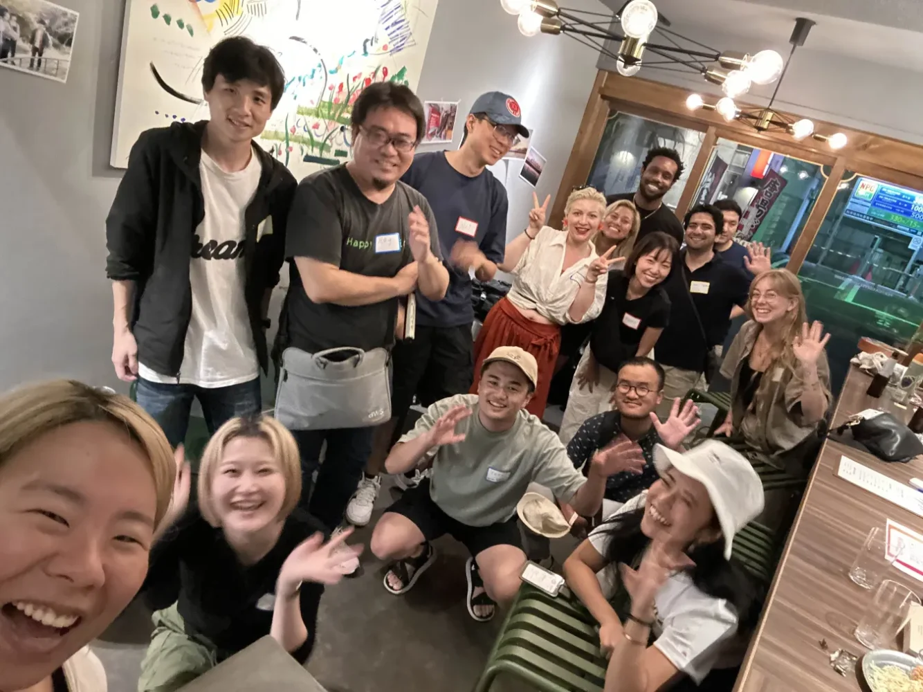 A group of digital nomads meeting at S-Tokyo coworking space in Tokyo, Japan.