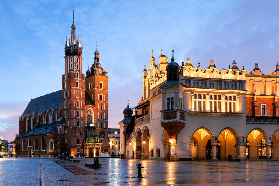 Ornate buildings in Kraków, Poland at sunset.