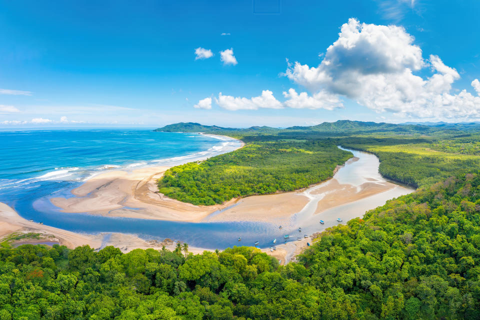 Aerial view of a beach and trees in&nbsp;Tamarindo, Costa Rica.