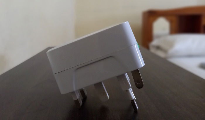 Universal travel adapter with multiple pins.