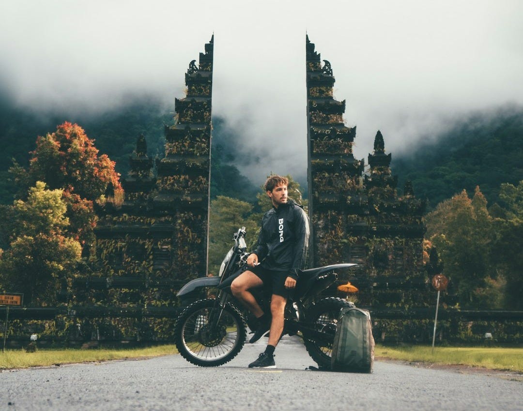 man sitting on dirtbike