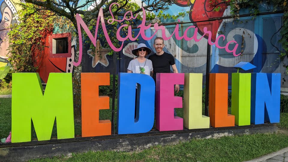 Bennett poses with his mom during one of his family's visits to Medellín. - Courtesy Jason Bennett