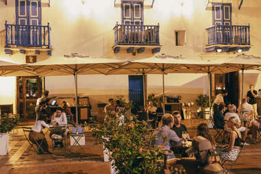 The patio area of El Barón at night.