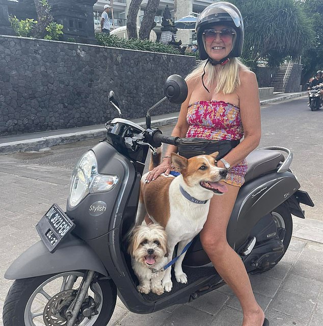 Isabel (pictured with her rescue dogs Chino and Tiga) has since moved to Seminyak, paying $450,000 for a 25-year lease on a three-bedroom villa with a pool that was in need of renovation