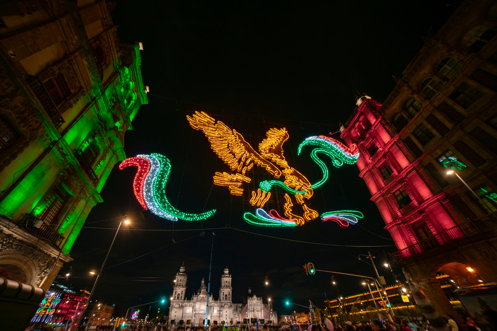 Mexican national symbol among colonial buildings on Independence Day.