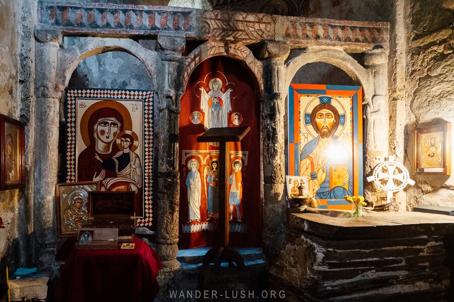 The alter inside Ushguli Lamaria Church decorated with icons and embroidered textiles.