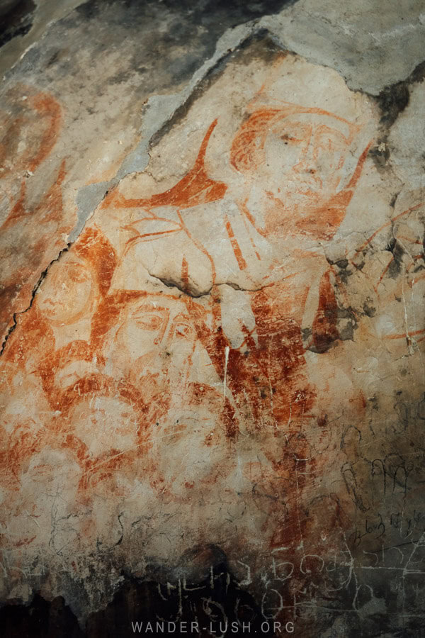 Faded frescoes inside Lamaria Church in Ushguli.