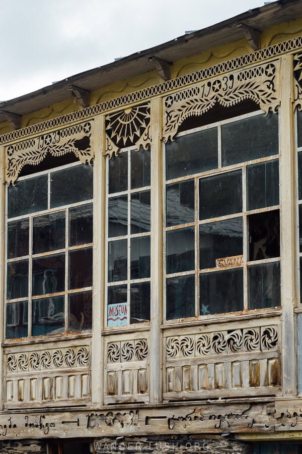 A beautiful timber house with carvings and windows in Ushguli, Georgia.