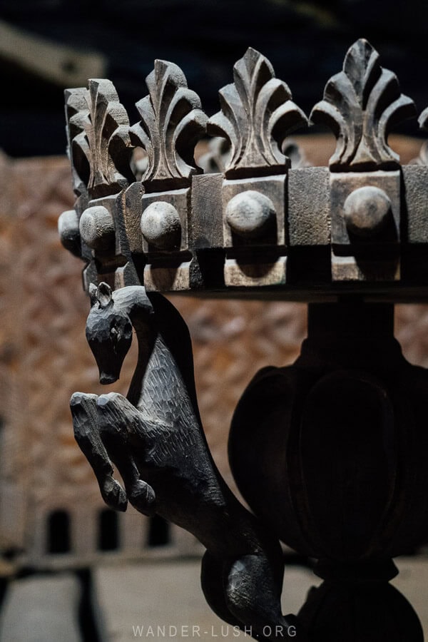 A wood carving depicting horses displayed in the Ethnographic Museum in Ushguli.