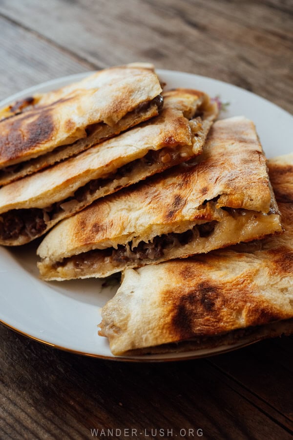 A plate of kubdari meat pie, dough stuffed with mince and onions and cut into triangles, served at a restaurant in Ushguli.