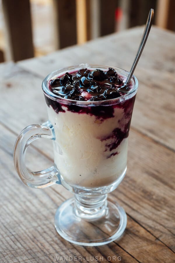 A glass of matsoni topped with blueberry jam served at a cafe in Ushguli, Georgia.