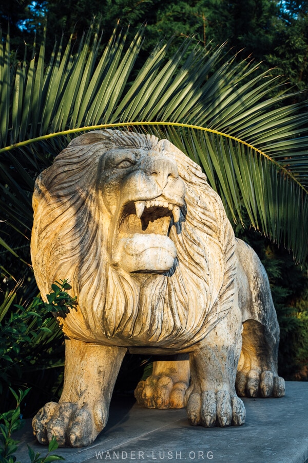 A sculpture of a lion on the bridge in Poti.