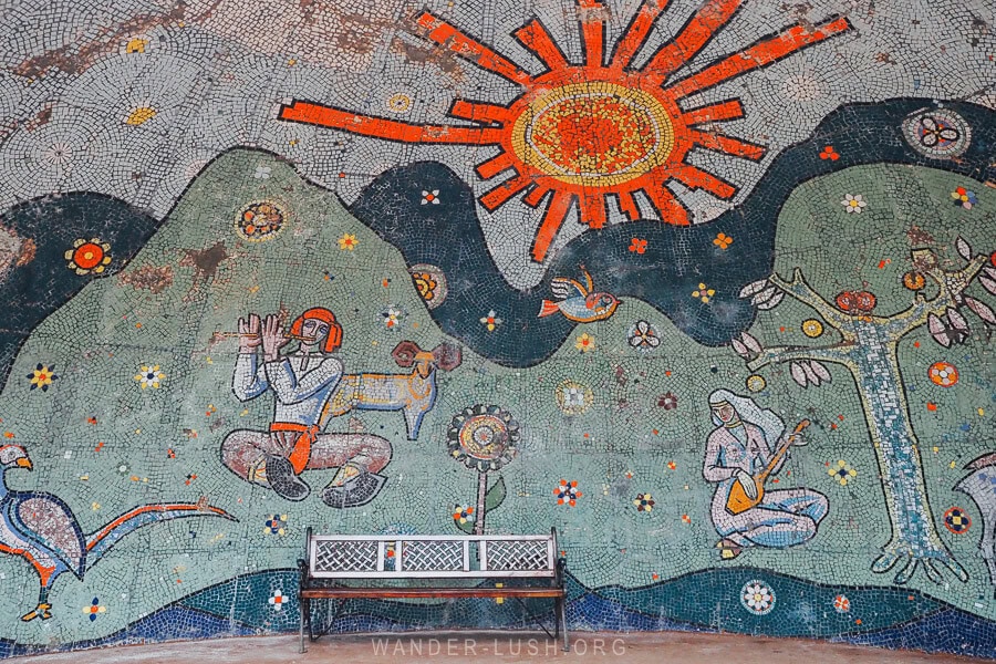 A decorative Soviet mosaic in Poti, Georgia, with a curved shape in the inside of an amphitheatre.