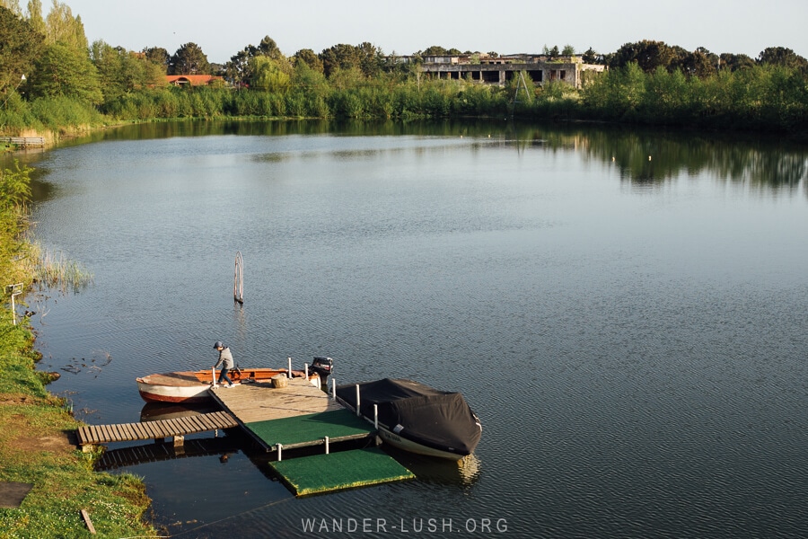 A jetty and boats on Okros Tba lake in Poti.