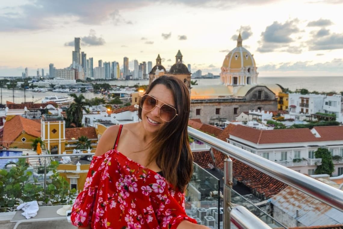 Girl taking a selfie with Cartagena's old town behind