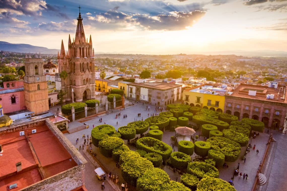 Central plaza of San Miguel de Allende with Gothic cathedral at sunset